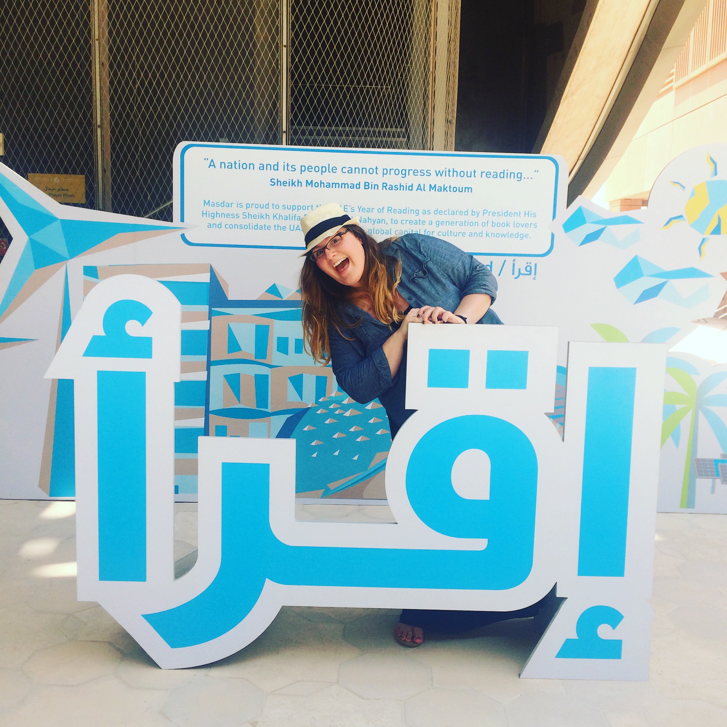 Amber loves all forms of literacy (as she demonstrates here in Abu Dhabi, UAE by posing behind a sign that says "Read!"), but she loves science literacy most of all.&nbsp;